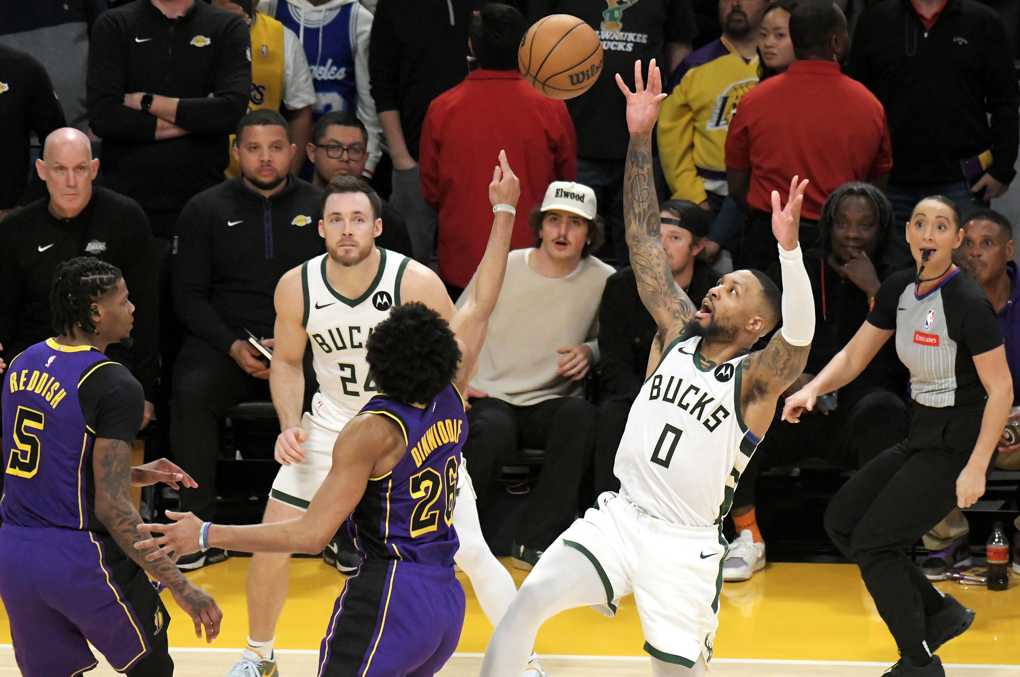 Russell's 44 points and Dinwiddie's emphatic block lead Lakers to victory over Milwaukee