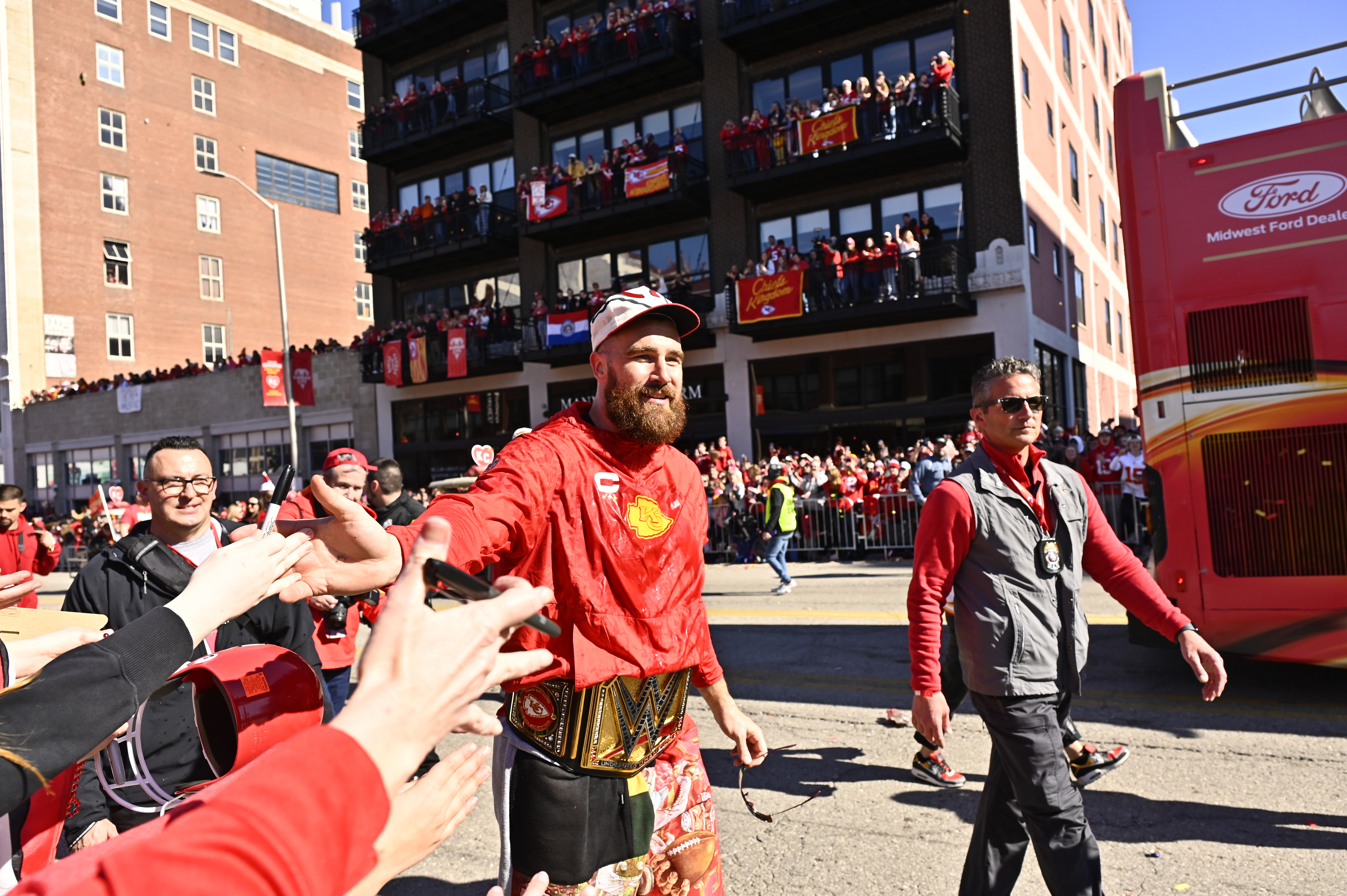 Travis Kelce poses for photos with young Taylor Swift fans