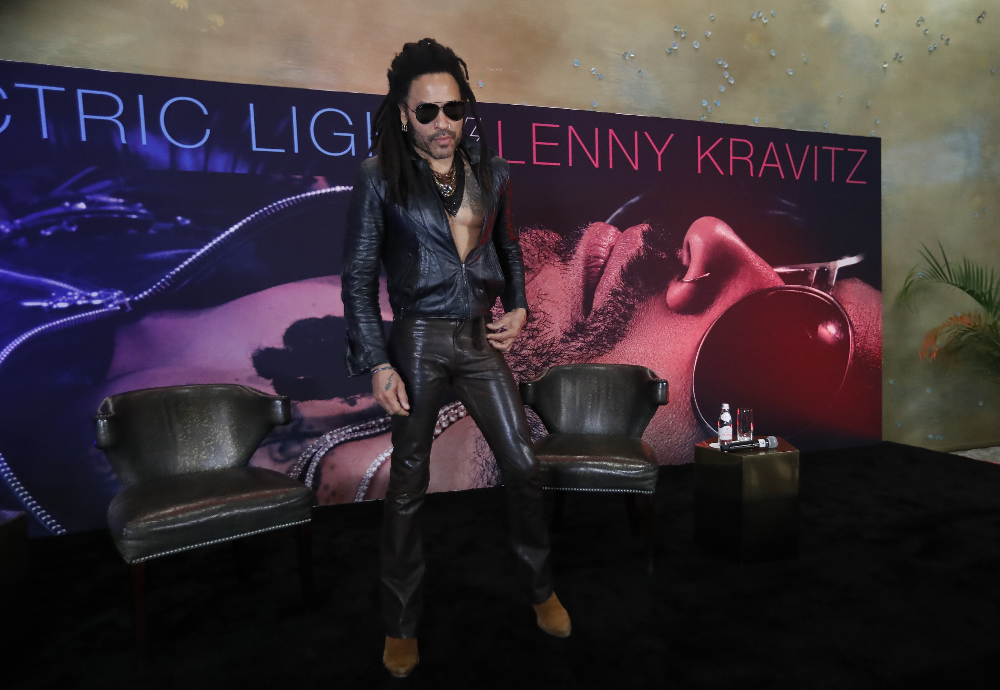 Lenny Kravitz at the gym in leather pants and black sunglasses