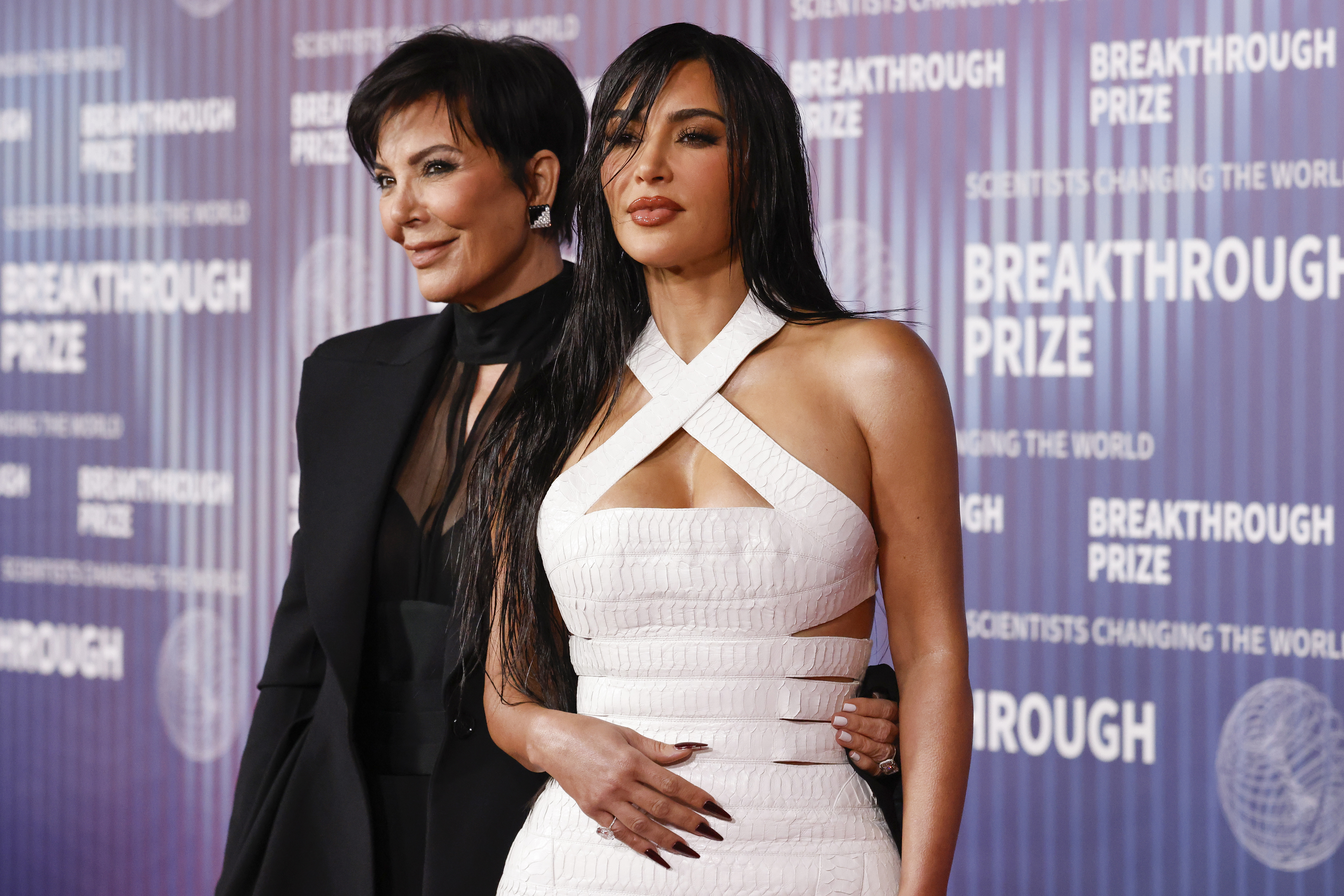 Kim Kardashian Stuns in White Leather Gown with Seductive Cutouts