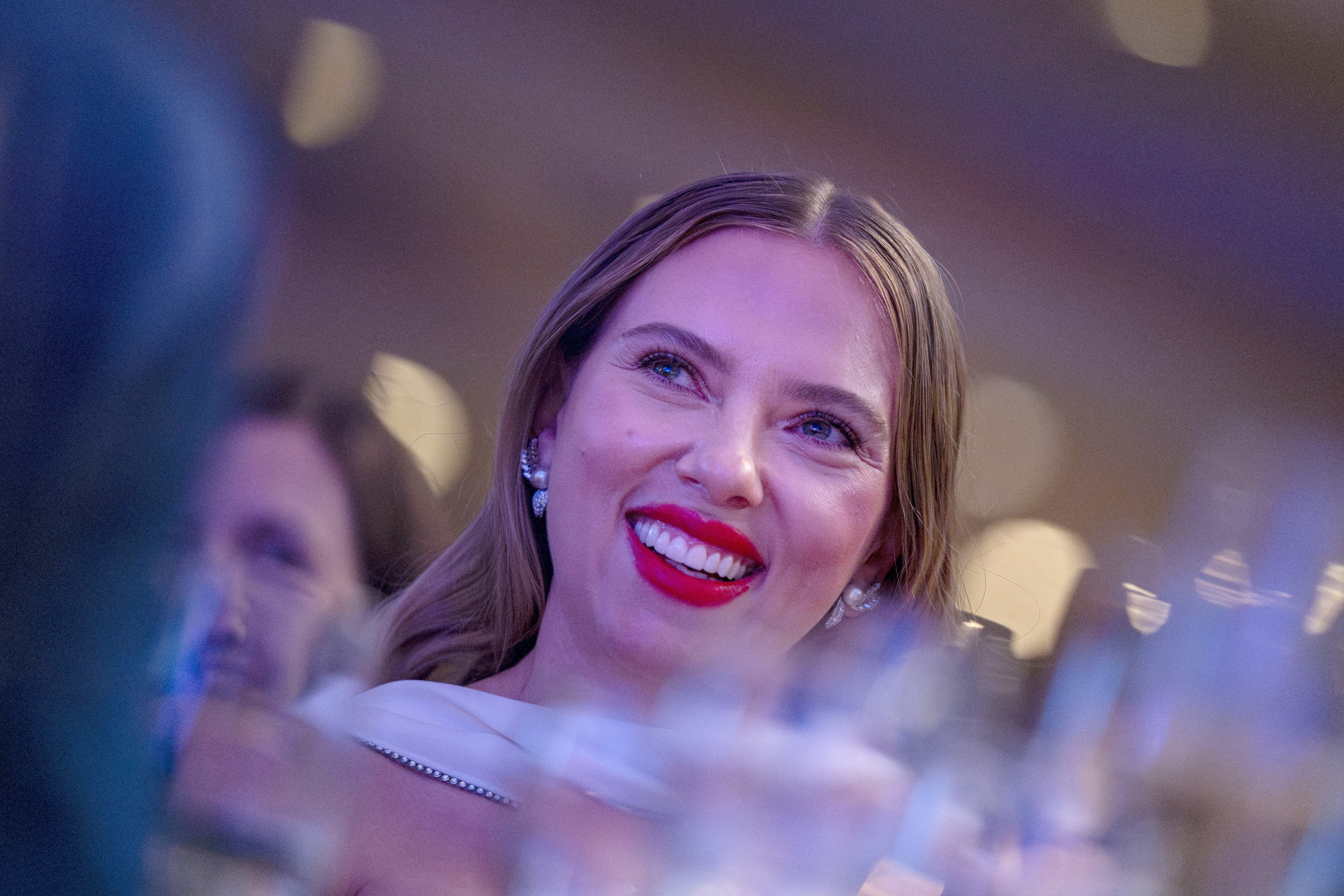 Scarlett Johansson embodies Old Hollywood with a white gown and matching shawl