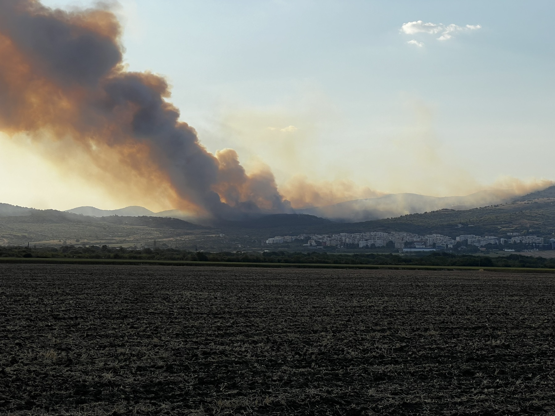 Volunteers gather for the fire early this morning in Stara Zagora