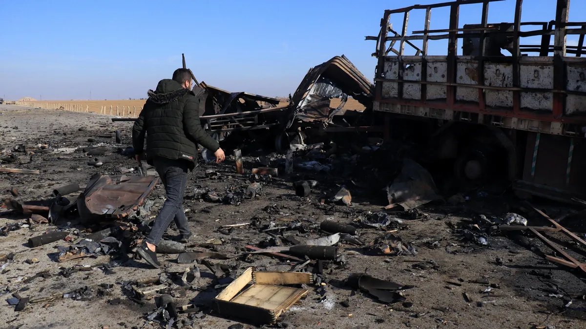 Assad's father's grave set on fire in his hometown in Syria