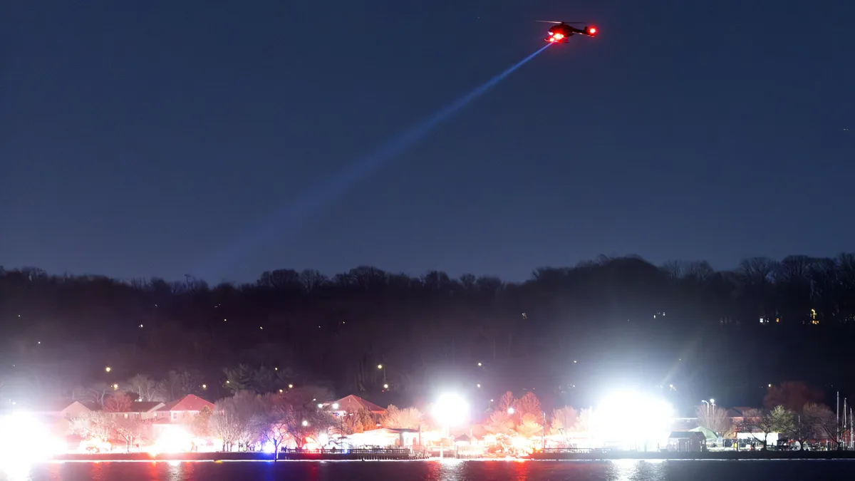 Plane with over 60 people on board collides with helicopter and crashes in Washington